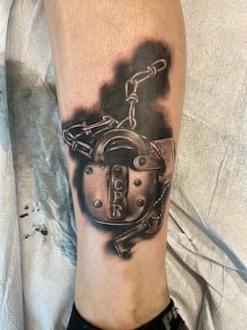 lock and key tattoo by mike Thompson hill