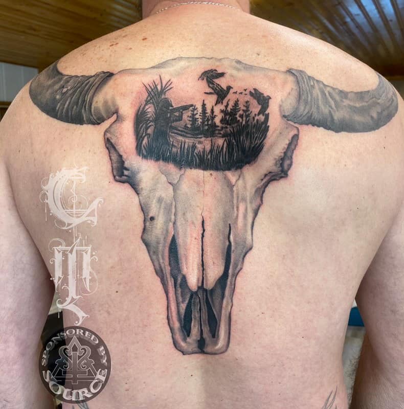 cow skull with duck hunting by mike Thompson hill