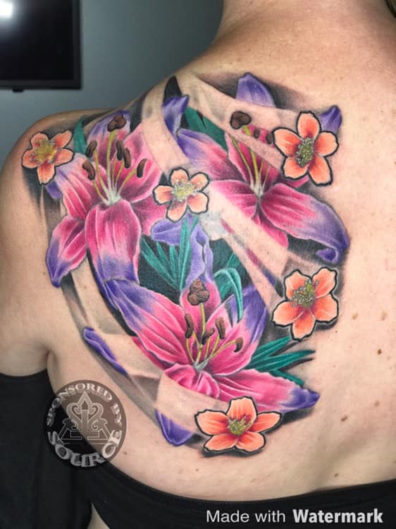 colourful lily tattoo by Mike Thompson hill