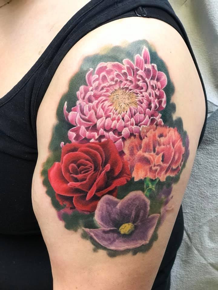 colourful flower tattoo by mike Thompson hill